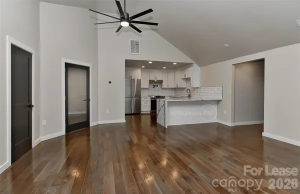 a view of kitchen with wooden floor