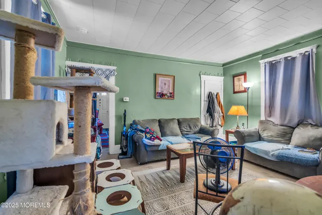 a view of a kitchen with refrigerator and a stove