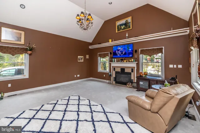 a kitchen with granite countertop wooden cabinets and a stove top oven