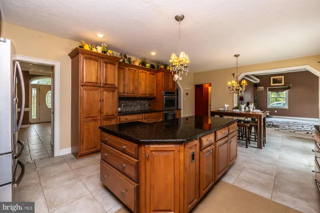 a bedroom with a bed couch and window