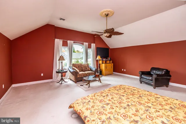 a front view of a house with a yard and fountain