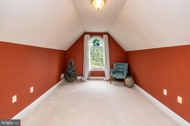 a view of dirt yard with a large tree