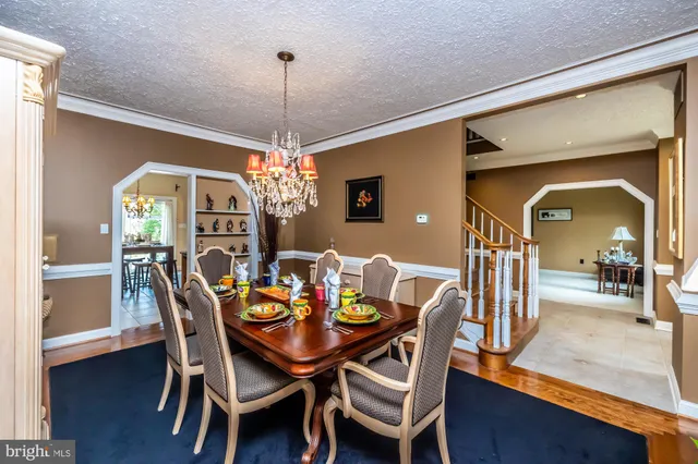 a kitchen with a table and chairs in it