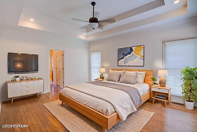 7 Sutton Place Jackson, TN 38305 - Photo 17 of 25 a bedroom with a bed and a flat screen tv