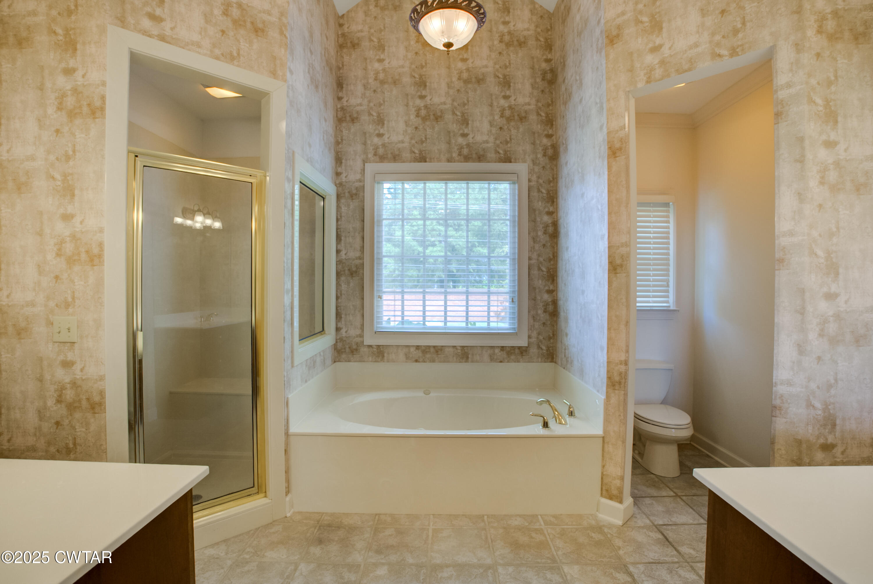7 Sutton Place Jackson, TN 38305 - Photo 18 of 25 a bathroom with a granite countertop bathtub shower and sink