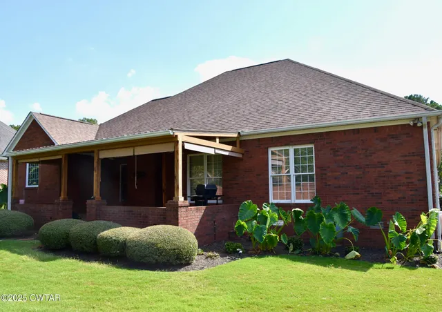 a house view with a garden space