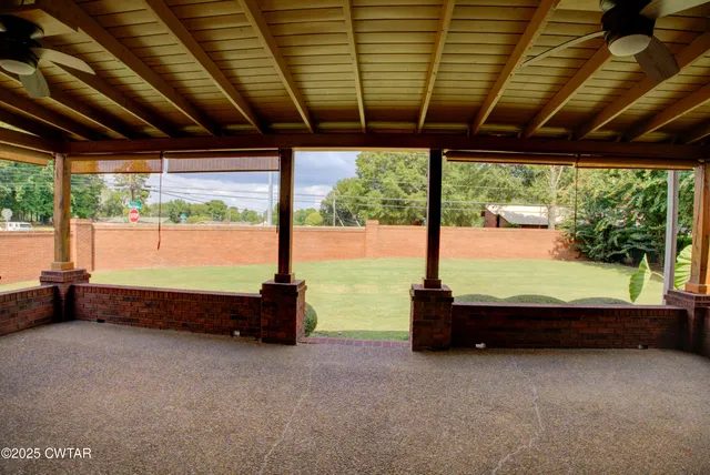 a backyard of a house with a garden and mountain view