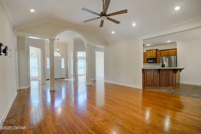 a view of livingroom with hardwood floor and a ceiling fan