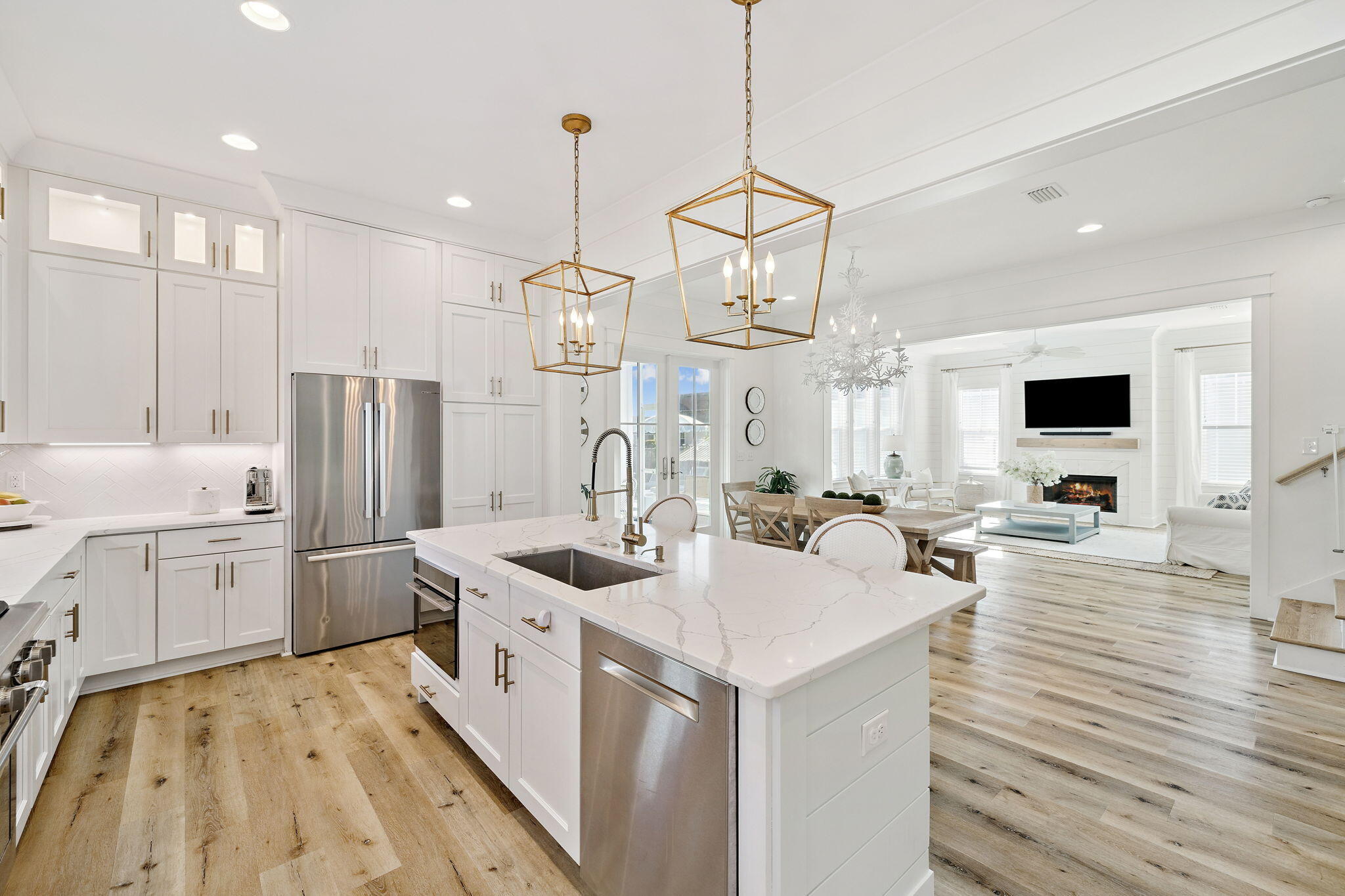 184 Sidecamp Rd Inlet Beach Inlet Beach, FL 32461 - Photo 22 of 48 a kitchen with stainless steel appliances a stove a sink dishwasher and a refrigerator with wooden floor