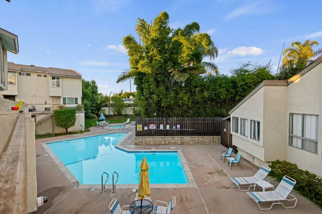 a view of swimming pool with outdoor seating