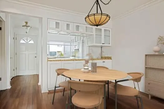 a dining room with furniture and window