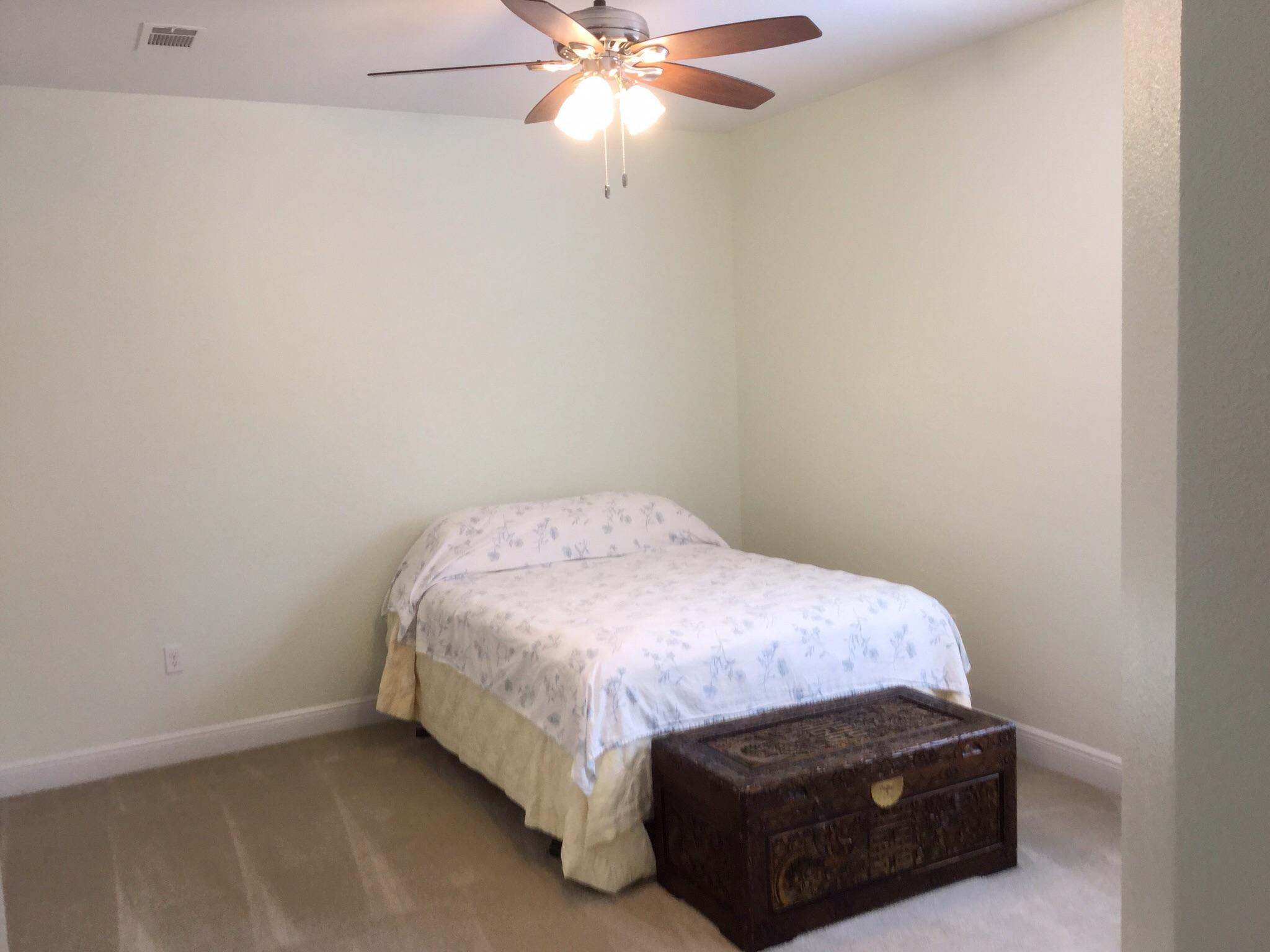 611 Red Fern Road Crestview, FL 32536 - Photo 22 of 37 a bedroom with a bed and a ceiling fan