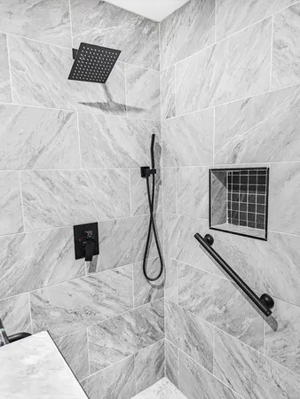 a bathroom with a shower and a sink