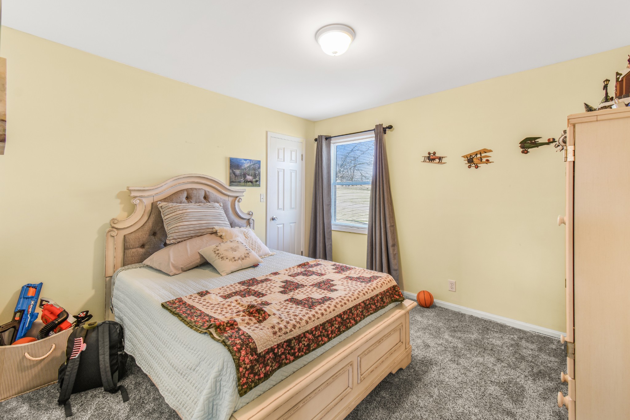 55 Morris Lane Carthage, TN 37030 - Photo 25 of 47 a bedroom with a bed and a dresser with wooden floor