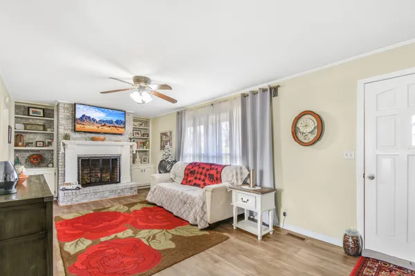 a living room with furniture and a fireplace