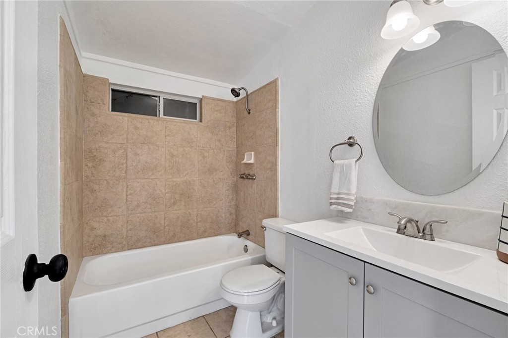 27331 Perkins Road Madera, CA 93637 - Photo 17 of 25 a bathroom with a sink a toilet and a mirror