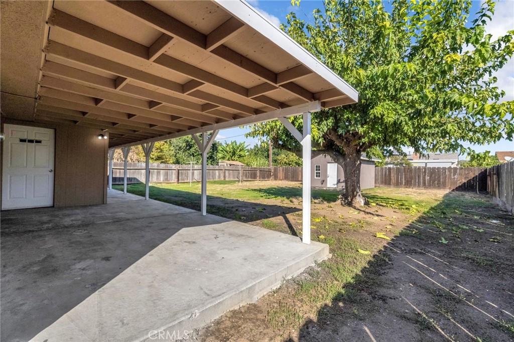 27331 Perkins Road Madera, CA 93637 - Photo 22 of 25 a view of a backyard with a small cabin