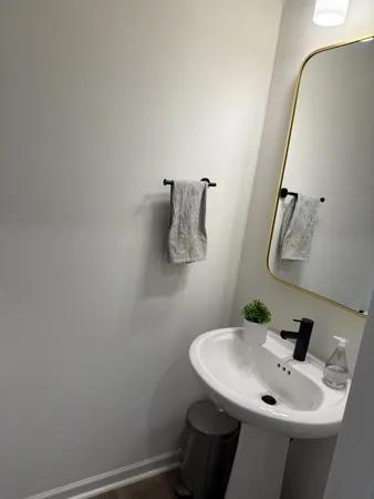 a bathroom with a sink and mirror