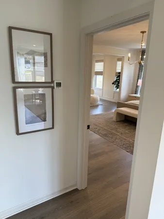 wooden floor with a bathroom
