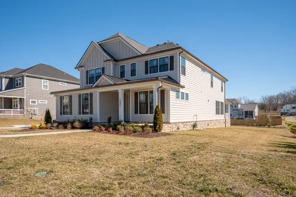 a front view of a house with a yard