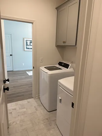 a kitchen with sink and cabinets