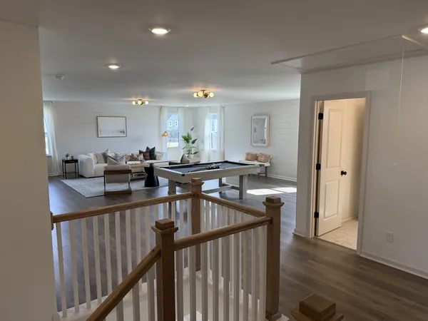 a bedroom with a bed couch and window