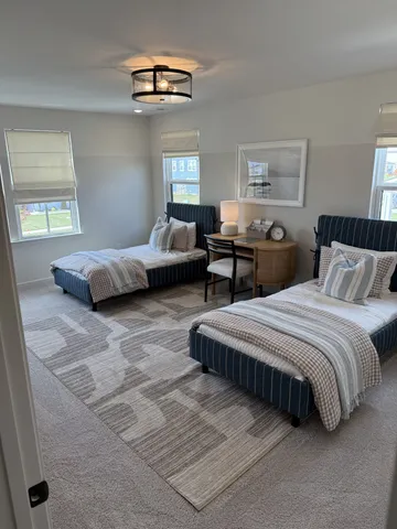 a bed room with bed and a window