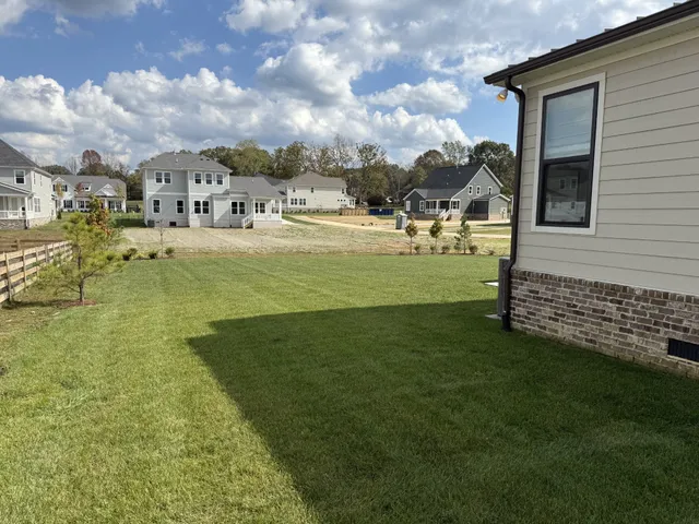 a view of yard with swimming pool