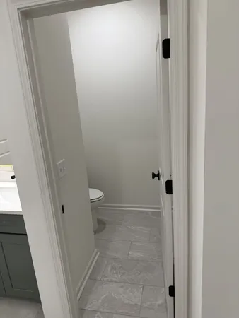 a bedroom with a bed and a night stand