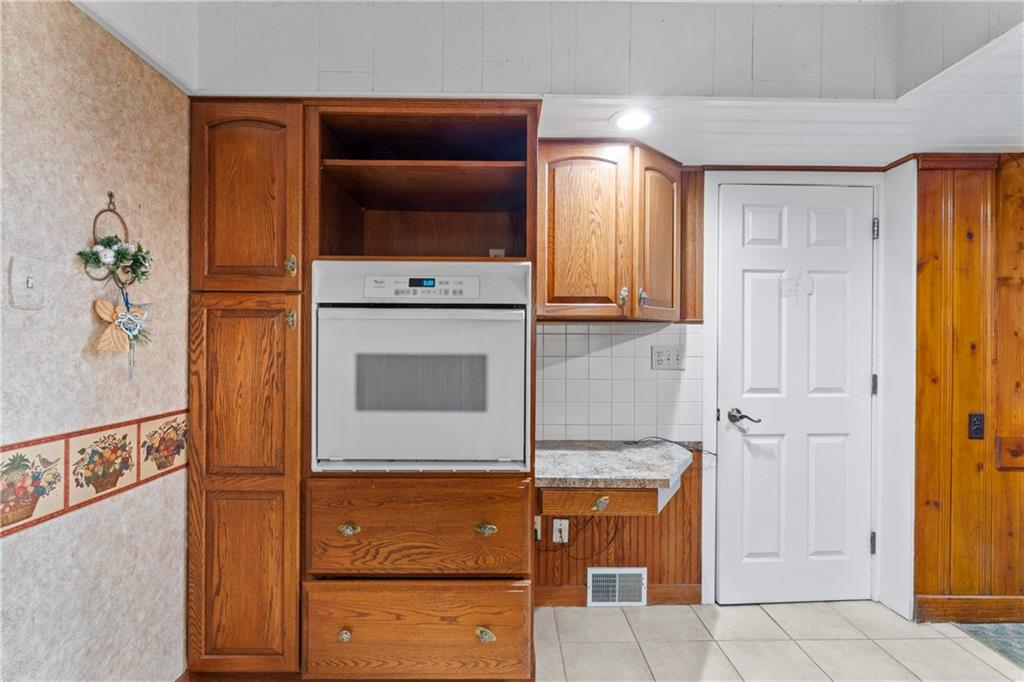 903 37th St Extension Beaver Falls, PA 15010 - Photo 12 of 29 a kitchen with stainless steel appliances granite countertop a refrigerator and a stove