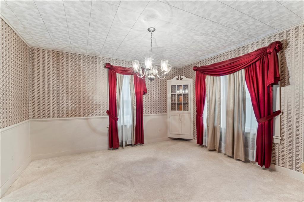 903 37th St Extension Beaver Falls, PA 15010 - Photo 16 of 29 a view of a room with furniture and a chandelier