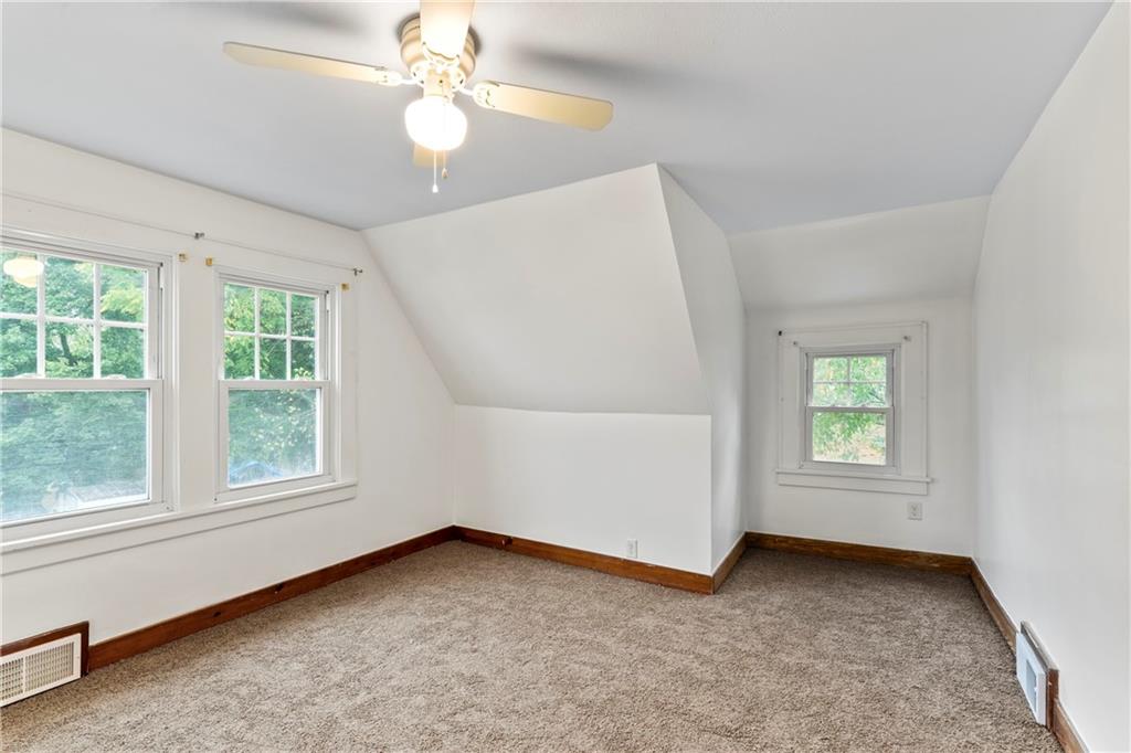 903 37th St Extension Beaver Falls, PA 15010 - Photo 19 of 29 an empty room with windows and ceiling fan