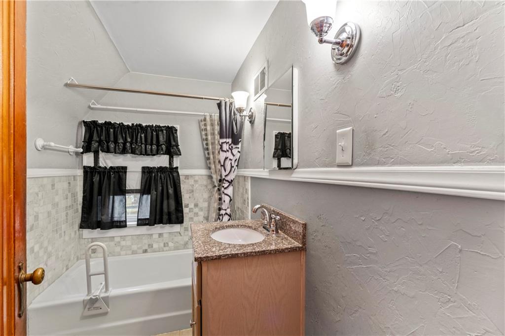 903 37th St Extension Beaver Falls, PA 15010 - Photo 23 of 29 a bathroom with a sink and a mirror