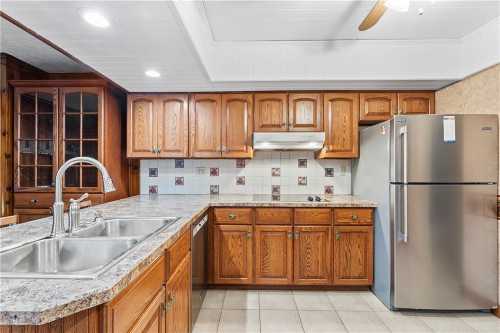 903 37th St Extension Beaver Falls, PA 15010 - Photo 10 of 29 a kitchen with a sink a refrigerator and window