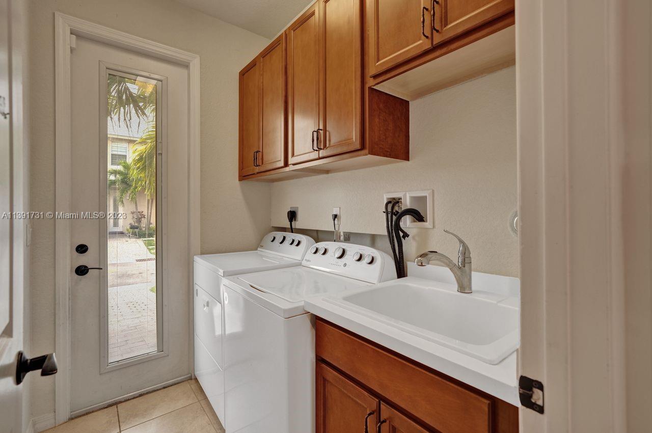 5060 Eucalyptus Drive, Unit 2 Hollywood, FL 33021 - Photo 15 of 56 a bathroom with a sink and a mirror