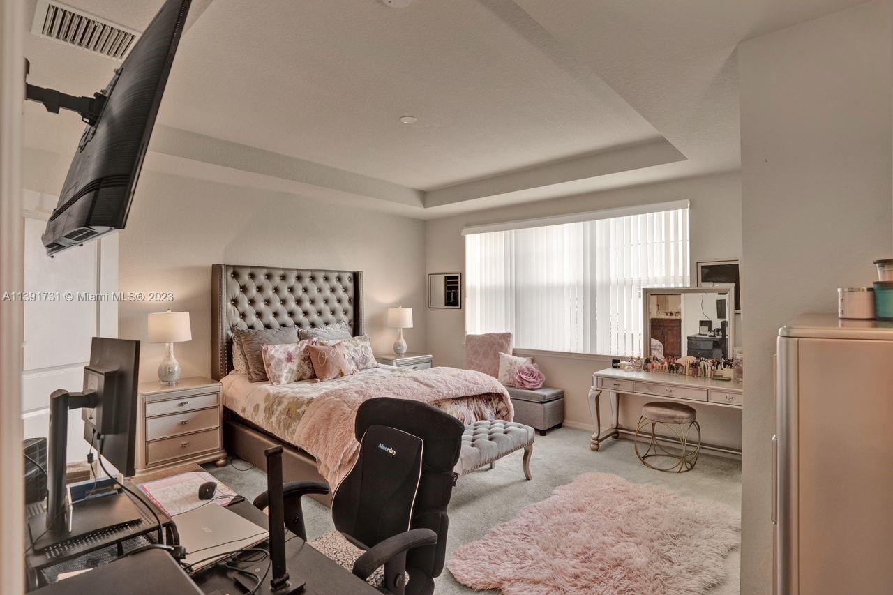 5060 Eucalyptus Drive, Unit 2 Hollywood, FL 33021 - Photo 19 of 56 a bedroom with furniture and a window