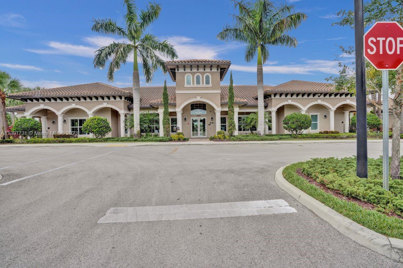 5060 Eucalyptus Drive, Unit 2 Hollywood, FL 33021 - Photo 35 of 56 a front view of a building with garden and parking