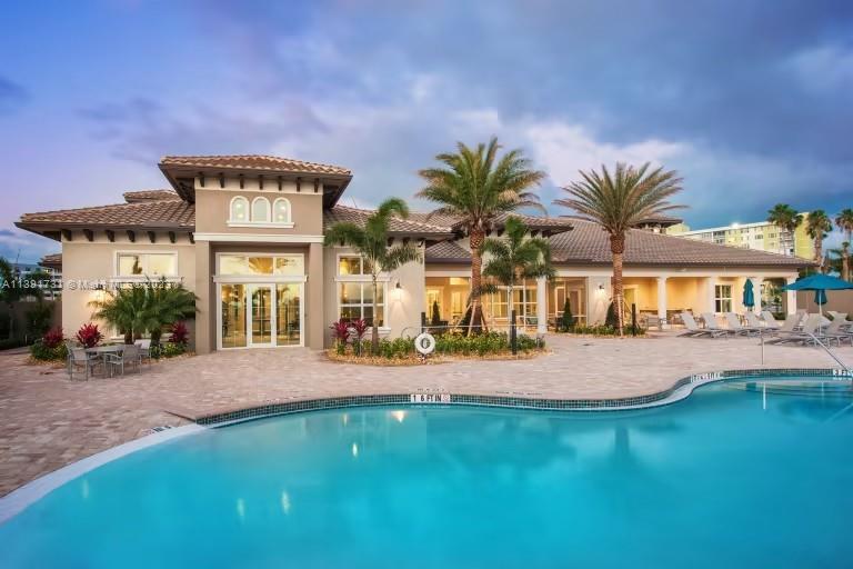 5060 Eucalyptus Drive, Unit 2 Hollywood, FL 33021 - Photo 36 of 56 a front view of house with yard and outdoor seating