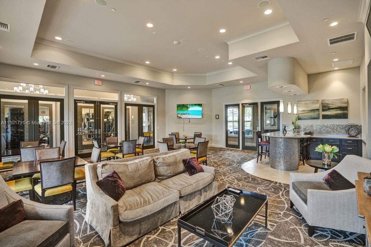 5060 Eucalyptus Drive, Unit 2 Hollywood, FL 33021 - Photo 39 of 56 a living room with furniture and a large window