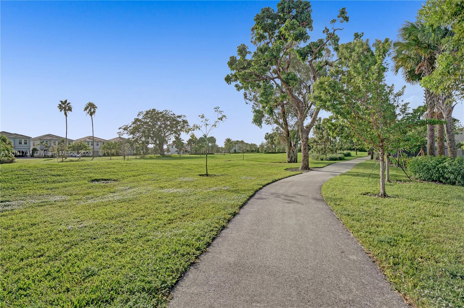 5060 Eucalyptus Drive, Unit 2 Hollywood, FL 33021 - Photo 52 of 56 a view of a golf course with a garden