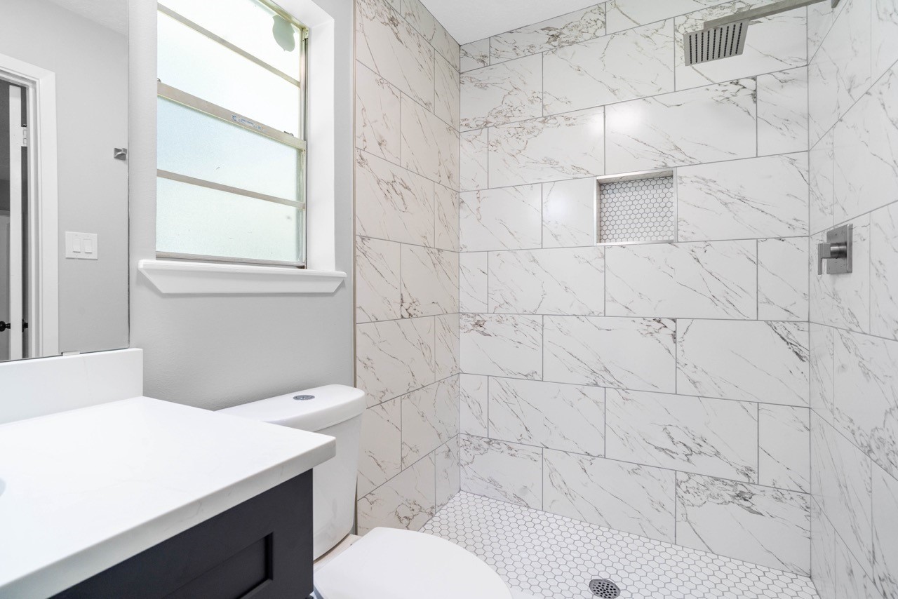 13400 Nicholson Road Conroe, TX 77303 - Photo 22 of 36 Shower newly remodeled with little shelf for your self-care goods. Also with a rainfall shower head.