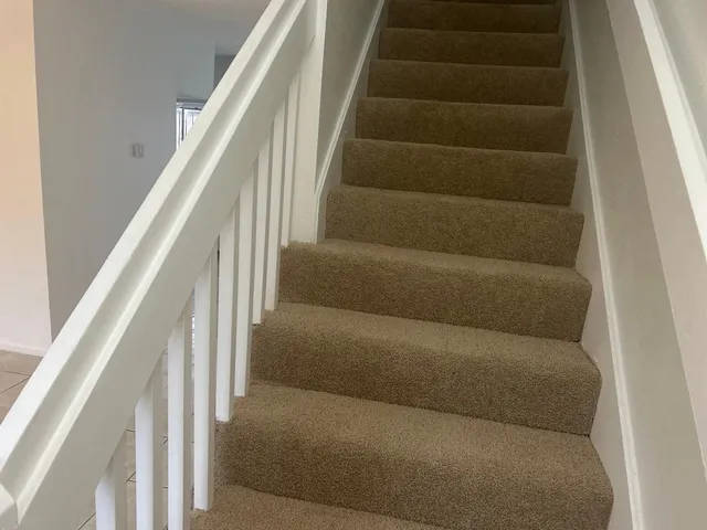 a view of staircase with white walls and white walls