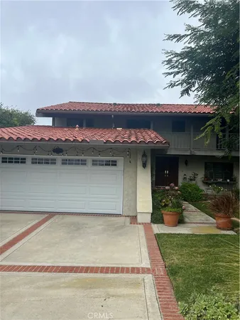 a front view of a house with a lake view