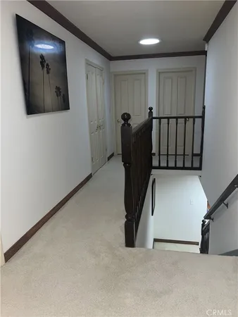 a view of a hallway with workspace
