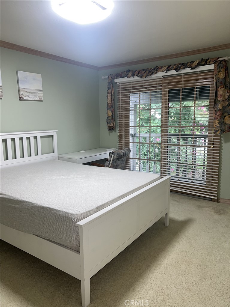 6747 Verde Ridge Road Rancho Palos Verdes, CA 90275 - Photo 20 of 34 a bed room with a bed and a large window