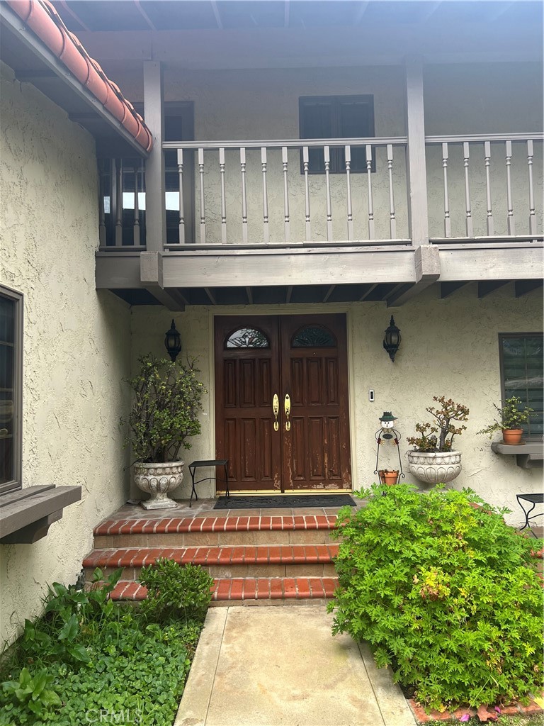 6747 Verde Ridge Road Rancho Palos Verdes, CA 90275 - Photo 2 of 34 a front view of a house with swimming pool and sitting area