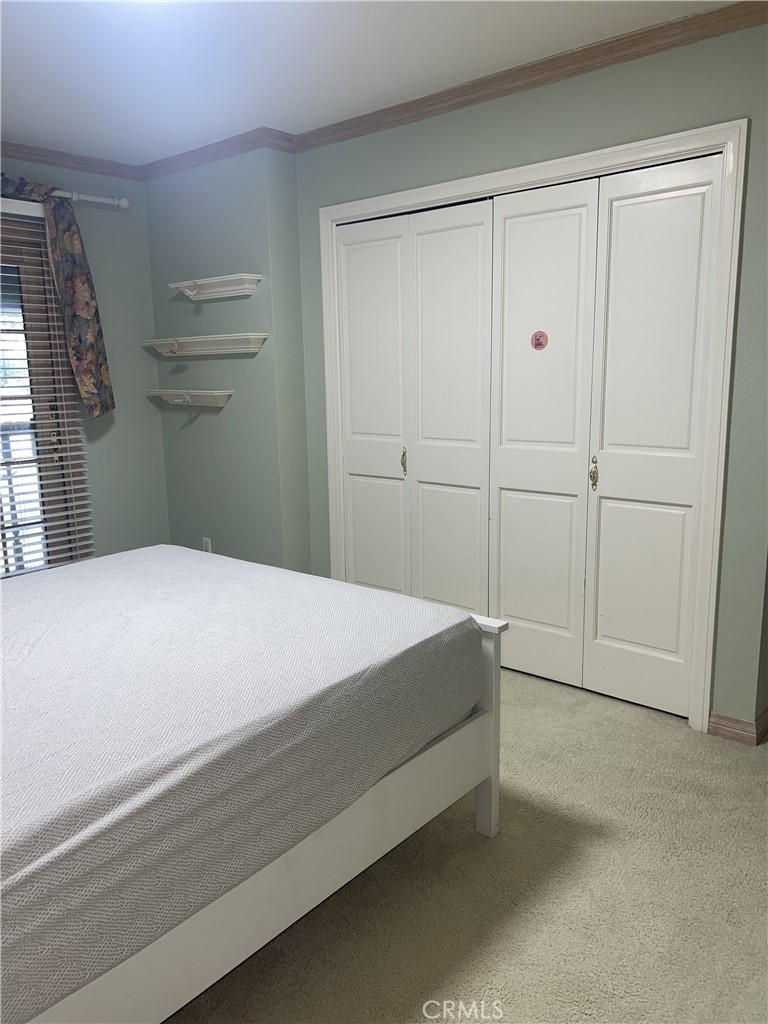 6747 Verde Ridge Road Rancho Palos Verdes, CA 90275 - Photo 21 of 34 a bedroom with a bed and cabinets