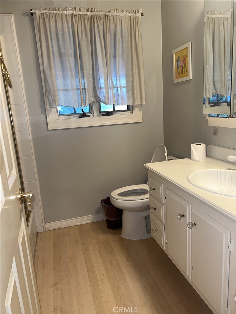 6747 Verde Ridge Road Rancho Palos Verdes, CA 90275 - Photo 22 of 34 a bathroom with a sink a toilet and a window