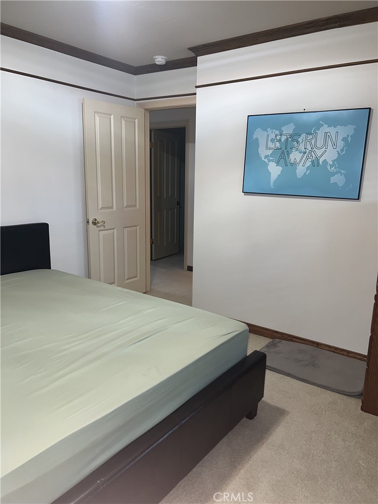 6747 Verde Ridge Road Rancho Palos Verdes, CA 90275 - Photo 24 of 34 a bedroom with a bed and wall painting