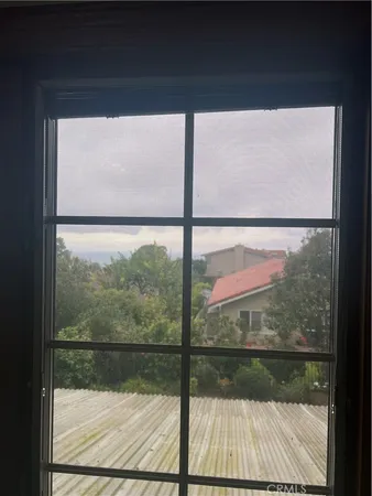 a view of a glass door with a glass table